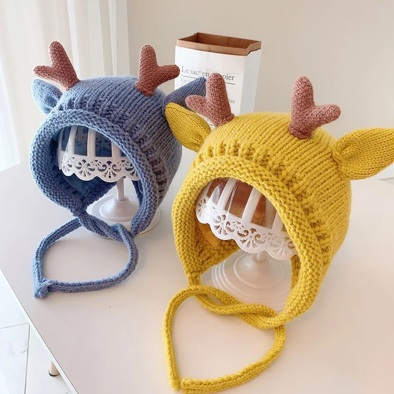 Cute winter baby beanie with elk antlers – warm knitted hat with ear protection 3