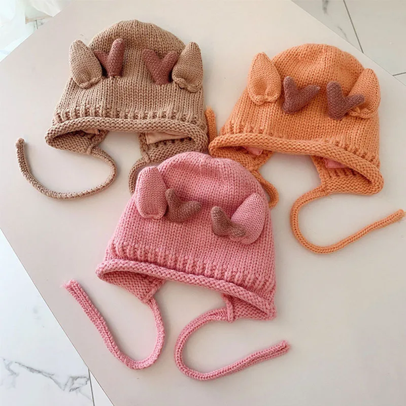 Cute winter baby beanie with elk antlers – warm knitted hat with ear protection 4