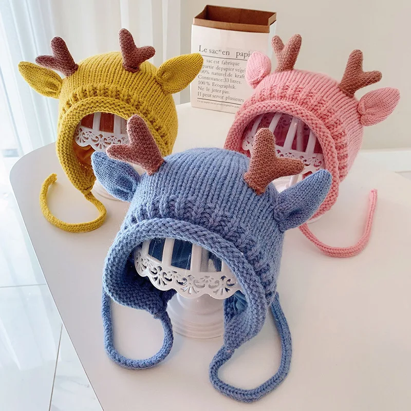 Cute winter baby beanie with elk antlers – warm knitted hat with ear protection 1